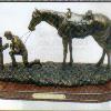 # ACT No. 88100BZ Praying Cowboy  13" L x 8" H.
Resign Fihurine - Sturdy molded resin figure wiht bronze finish.